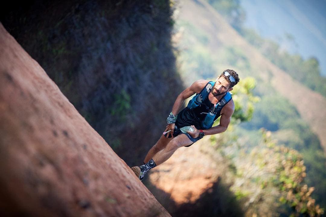 The Coastal Challenge racer climbing a ridgeline